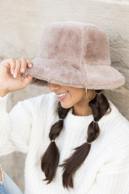 Side profile of woman wearing Izzie Plush Bucket Hat in Cream, cozy plush bucket hat for fall