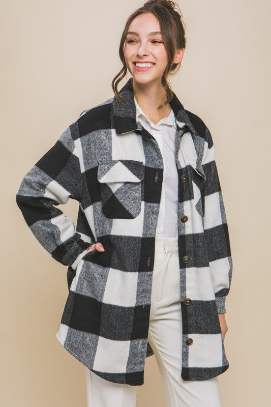 Black plaid shacket with button closure, long sleeves, and functional pockets.