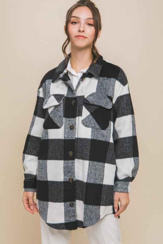 Black plaid shacket with button closure, long sleeves, and functional pockets.