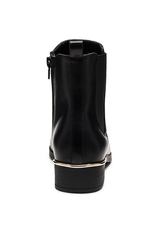 Rear view of black Chelsea boots showing pull tab and gold heel trim.