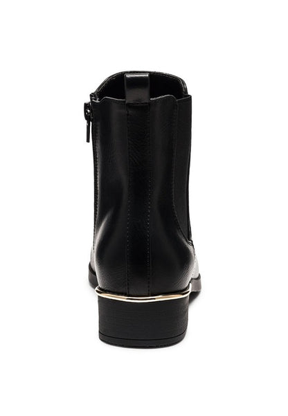 Rear view of black Chelsea boots showing pull tab and gold heel trim.