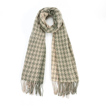 Sofiya Houndstooth Scarf in sage green two-tone print with textured fringes, perfect for a cozy winter look.
