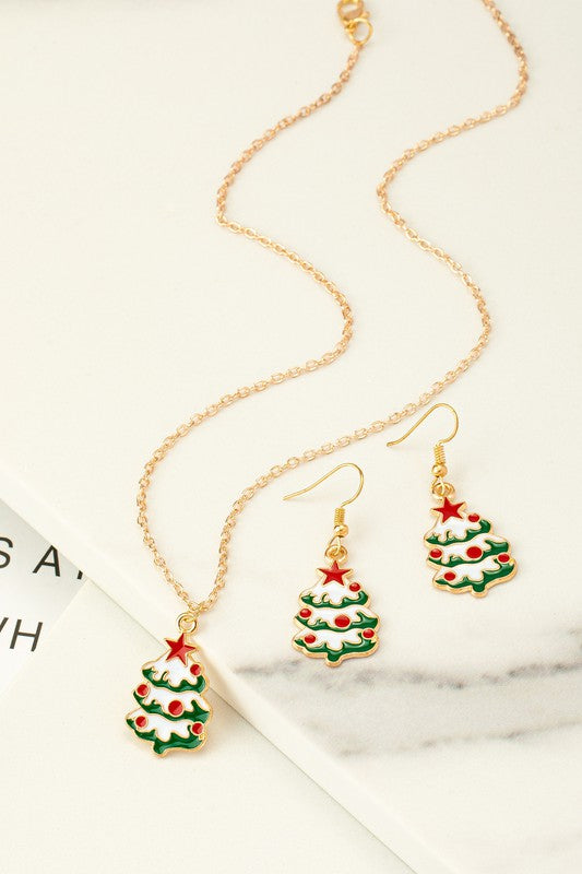 Festive jewelry set with a green and white Christmas tree pendant on an 18" necklace with a 3" extender, and matching drop earrings. 