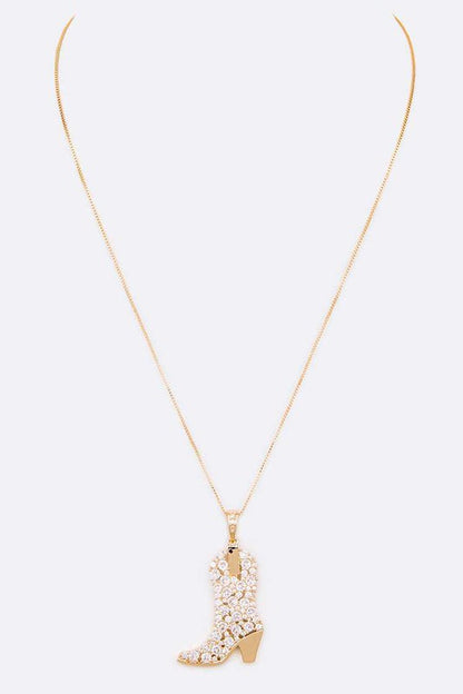 Sadie Cowboy Boot Pendant Necklace in gold, shown with long adjustable chain and detailed boot charm.