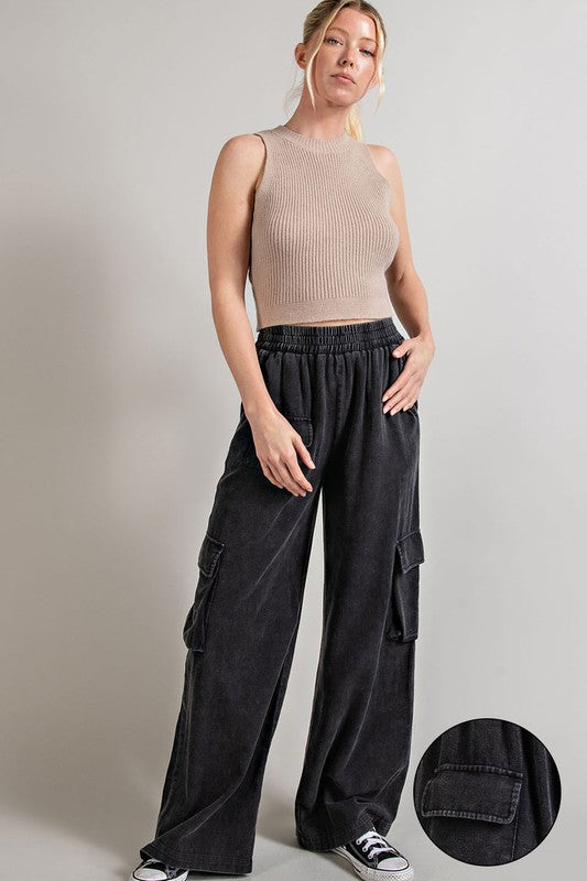 Wide-leg mineral-washed cargo pants in ash gray with an elastic waist and multiple pockets.