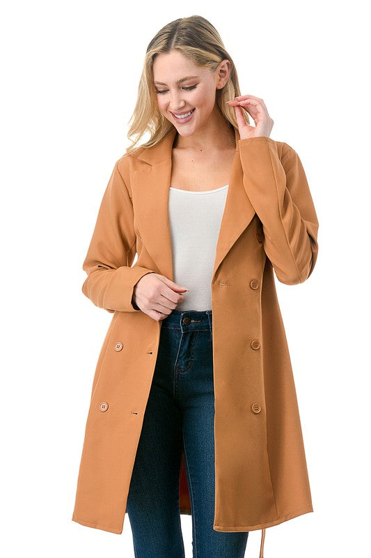 Blazer jacket in Camel is an oversized, knee-length blazer with a waist tie, suit collar, and button closure.