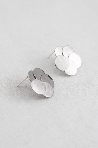 Round and Round Earrings in Gunmetal angled flatlay showing layered discs.