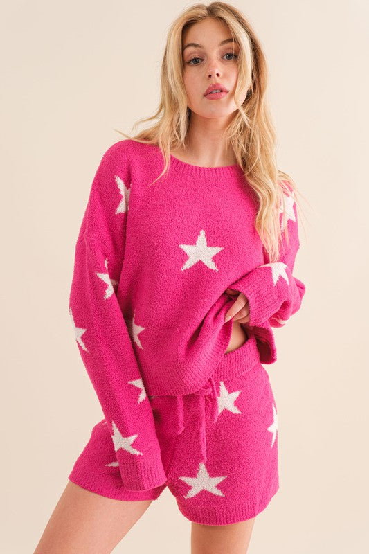 Hot pink lounge set with a star print, featuring a long-sleeve round-neck top and drawstring shorts.