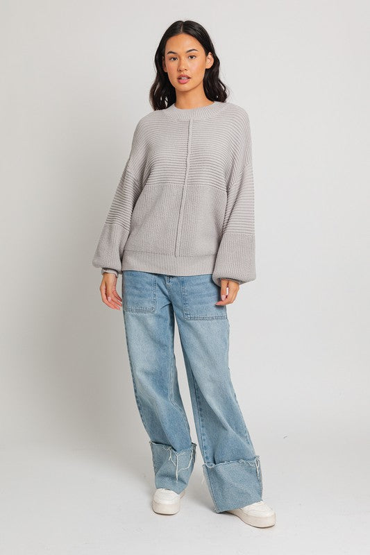 Grey ribbed knit sweater with balloon sleeves and banded cuffs.