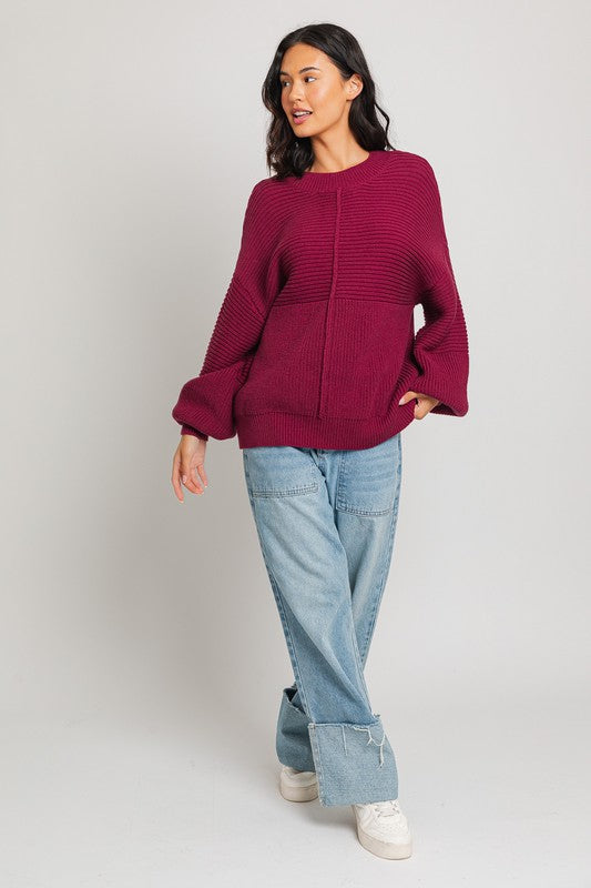 Wine ribbed knit sweater with balloon sleeves and banded cuffs.