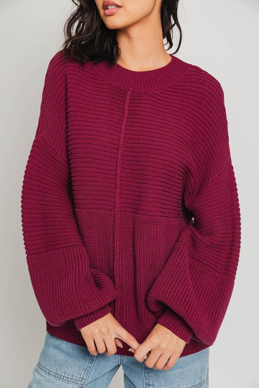 Wine ribbed knit sweater with balloon sleeves and banded cuffs.