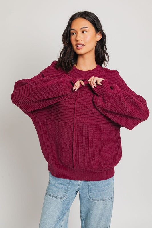 Wine ribbed knit sweater with balloon sleeves and banded cuffs.