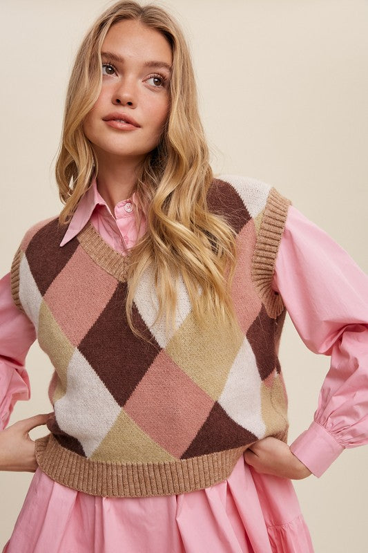 Pink, multi-color patterned sweater vest, oversized fit, with a V-neck and sleeveless design.