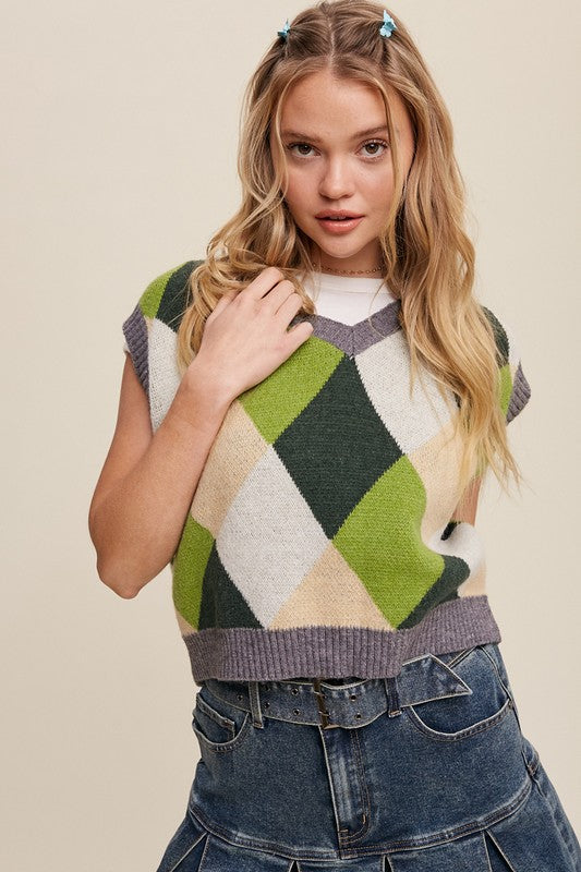 Green, multi-color patterned sweater vest, oversized fit, with a V-neck and sleeveless design.