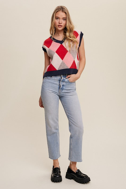 Red, multi-color patterned sweater vest, oversized fit, with a V-neck and sleeveless design.