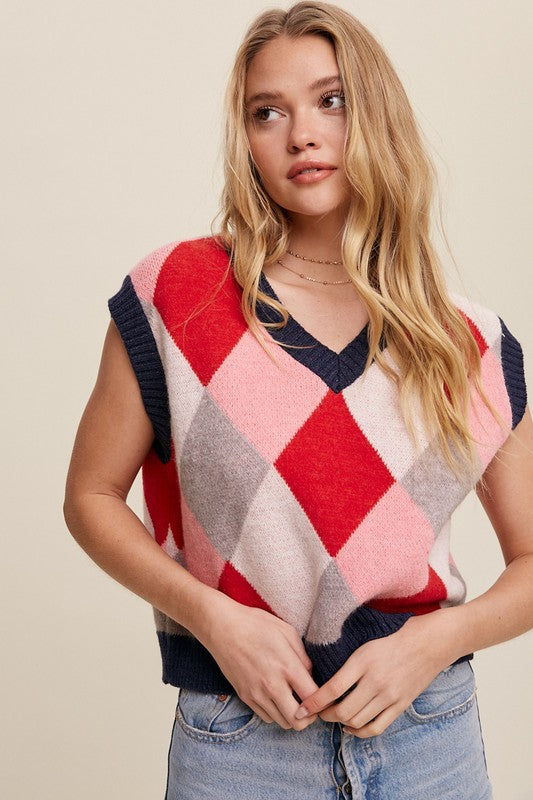 Red, multi-color patterned sweater vest, oversized fit, with a V-neck and sleeveless design.