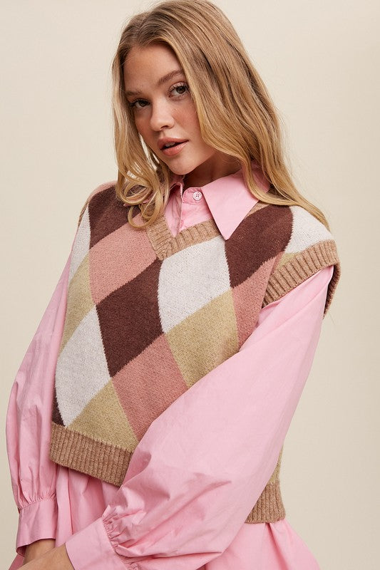 Pink, multi-color patterned sweater vest, oversized fit, with a V-neck and sleeveless design.