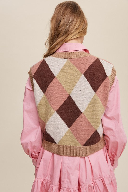 Pink, multi-color patterned sweater vest, oversized fit, with a V-neck and sleeveless design.