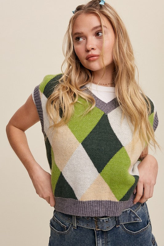 Green, multi-color patterned sweater vest, oversized fit, with a V-neck and sleeveless design.