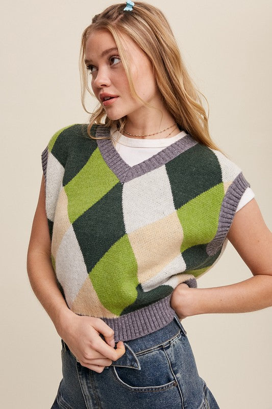 Green, multi-color patterned sweater vest, oversized fit, with a V-neck and sleeveless design.