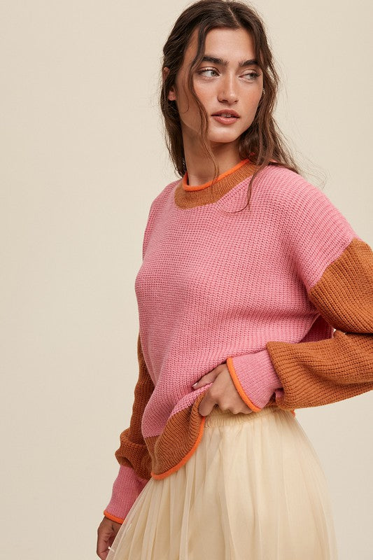 Color block ribbed knit sweater in pink, rust, and orange, featuring a round neckline, drop shoulders, and long sleeves. Regular fit, pullover design.