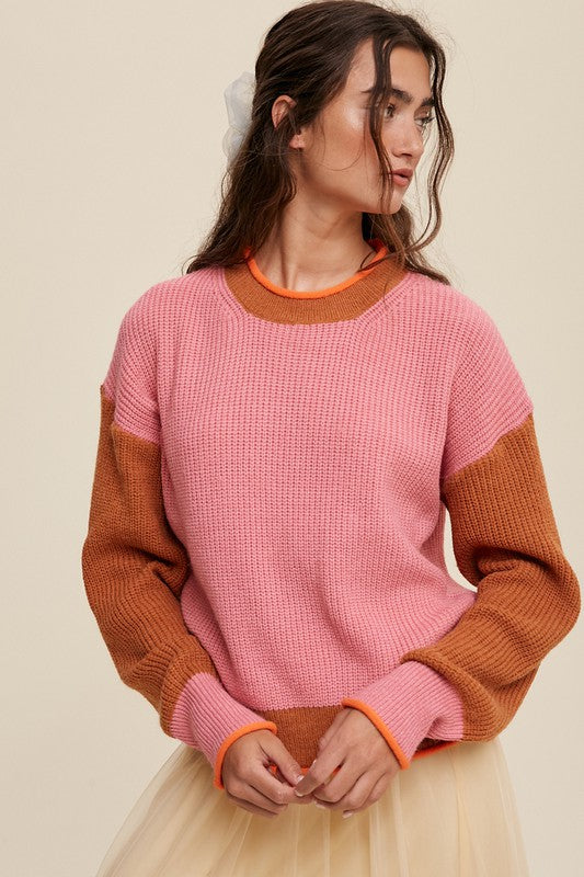 Color block ribbed knit sweater in pink, rust, and orange, featuring a round neckline, drop shoulders, and long sleeves. Regular fit, pullover design.