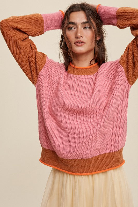 Color block ribbed knit sweater in pink, rust, and orange, featuring a round neckline, drop shoulders, and long sleeves. Regular fit, pullover design.