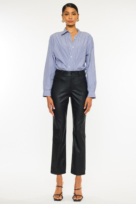 Black faux leather, high rise skinny jeans by Kan Can USA, featuring cropped, straight leg design, and double button closure. 