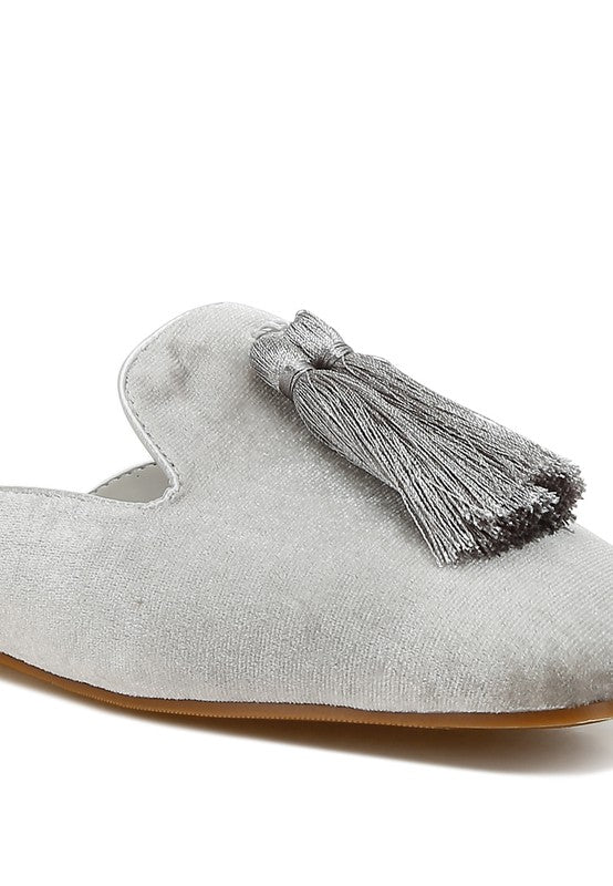 Silver mules with velvet upper and tassel detail.