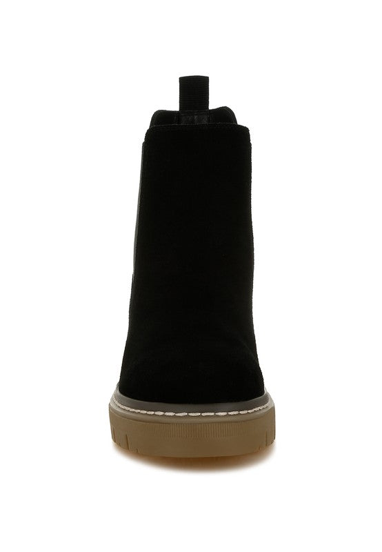 Black Vostok Chelsea boots, suede finish with pull tabs.