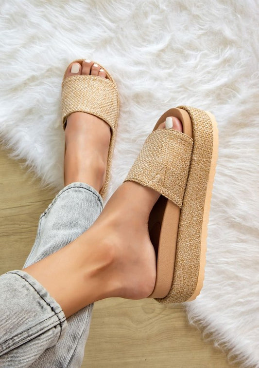 Woman wearing tan Tina Woven Flatform Sandals with 2-inch cushioned sole, slip-on design, and breezy summer style.