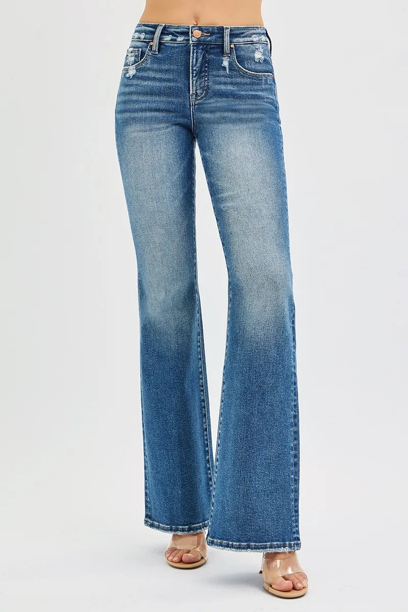 Size inclusive Jordy Tummy Control High Rise Flare Jeans in dark wash.