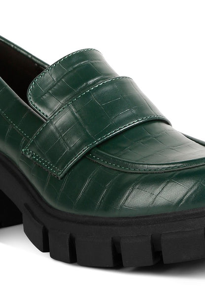 Close up of Benz Platform Loafers in dark green showing croc-embossed texture
