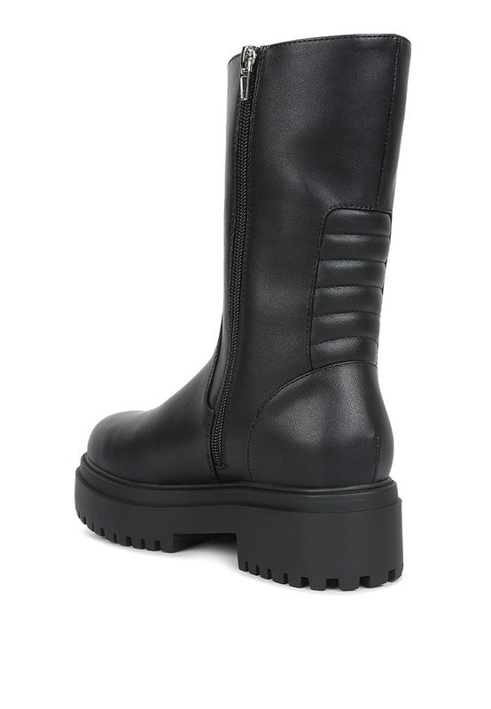 Back angle side view of Lewisa Paneled Lug Sole Boots in black with lug sole detail