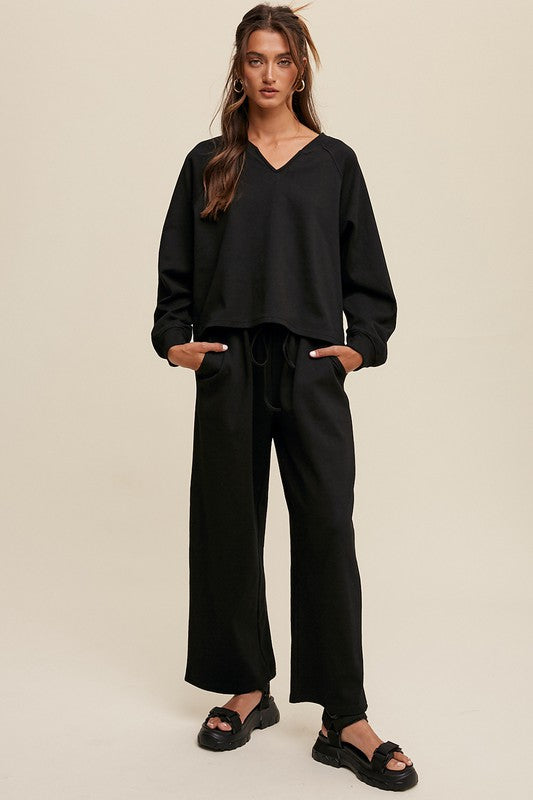 Solid casual sweatshirt and pants set with a V-neck, long sleeves, and drawstring waist.