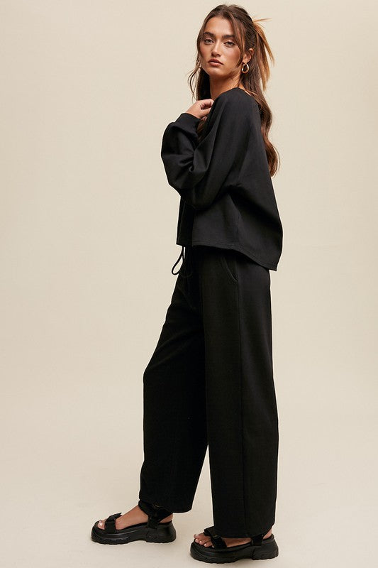 Solid casual sweatshirt and pants set with a V-neck, long sleeves, and drawstring waist.