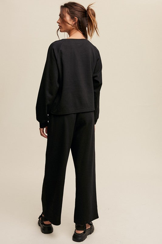 Solid casual sweatshirt and pants set with a V-neck, long sleeves, and drawstring waist.