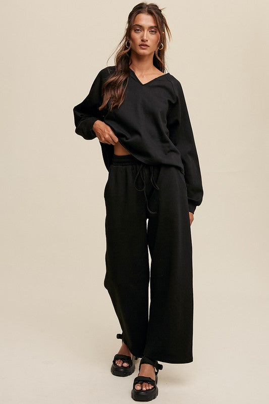 Solid casual sweatshirt and pants set with a V-neck, long sleeves, and drawstring waist.