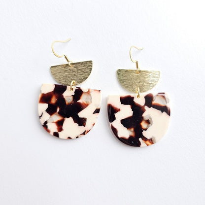 Harper Cowhide Print Earrings on white background with 18K gold-plated hooks and brushed brass accents.