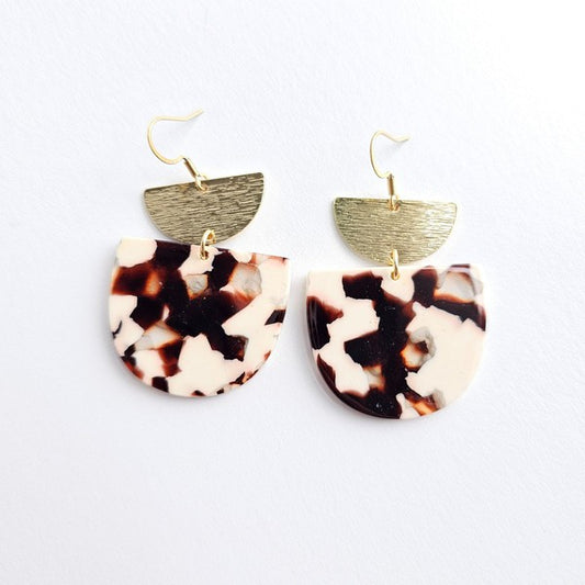 Harper Cowhide Print Earrings on white background with 18K gold-plated hooks and brushed brass accents.