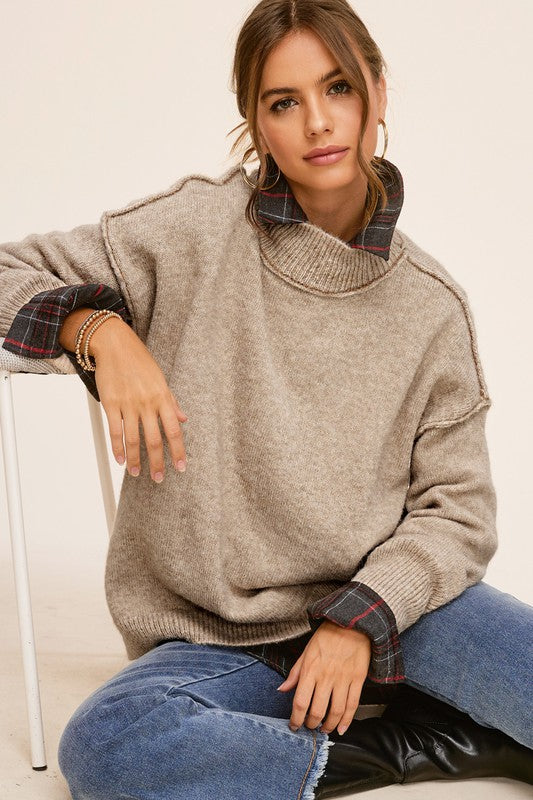 Cozy knit mock neck sweater in taupe, featuring long sleeves, drop shoulders, and an oversized fit.