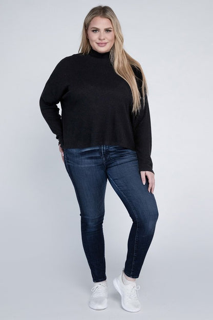 Plus size full body view of Raya Curvy Plus Drop Shoulder Top in black styled with jeans and sneakers.