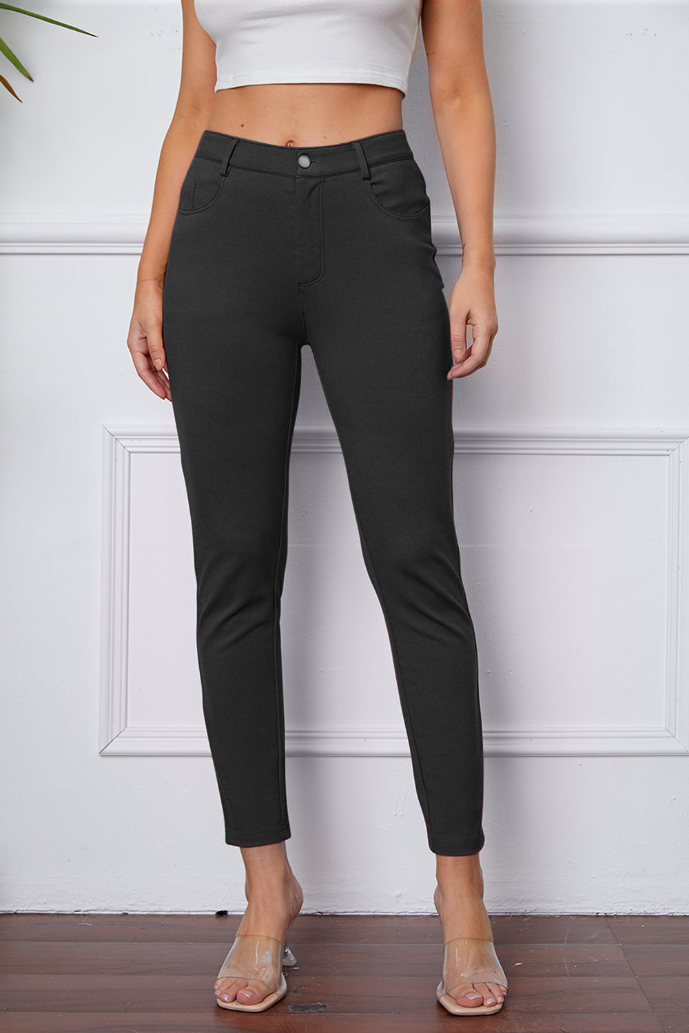 Heather Gray stretchy high-waisted pants feature pockets, a zip fly, and belt loops. 