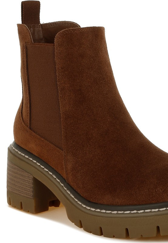 Brown suede Chelsea boots showcasing gusset and stitching details.