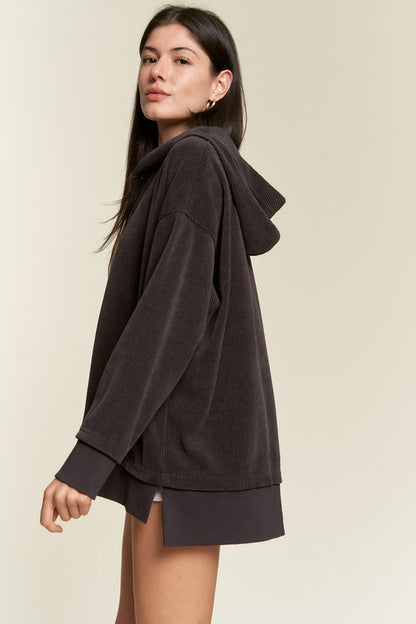 Side profile of charcoal Kenzie Plus Size Hooded Sweatshirt highlighting ribbed knit and drop shoulder.