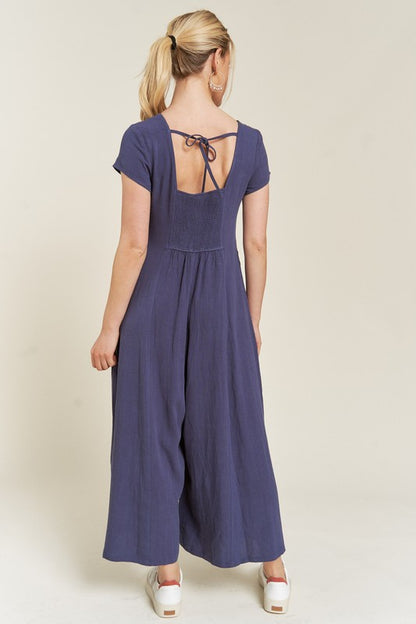 Navy Seona Linen Plus Size Jumpsuit back view with relaxed drape and short sleeves.