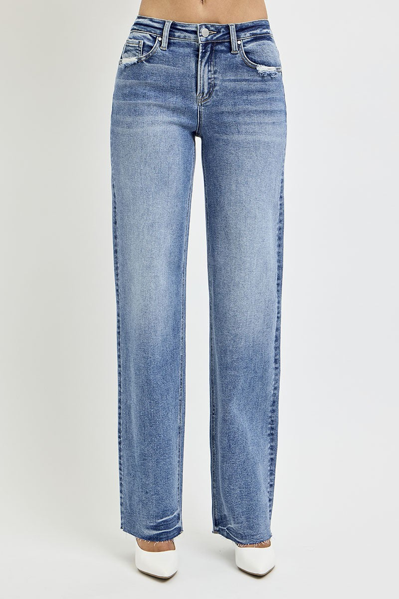 Risen Dana High Rise Straight Leg Jeans in medium wash, featuring a flattering high-waisted fit, slightly stretchy fabric, raw hem, and versatile straight-leg silhouette.