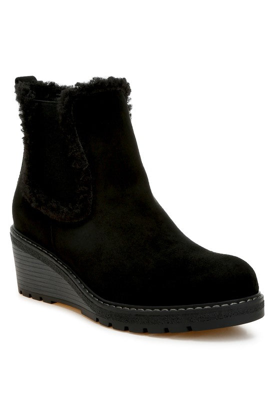 Black Thunderhoof Chelsea Boots front angle with faux fur lining and wedge heel.