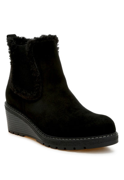 Black Thunderhoof Chelsea Boots front angle with faux fur lining and wedge heel.