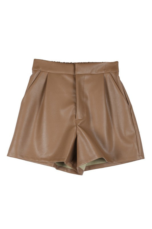 Stylish brown vegan leather shorts with a hook and zipper closure, side pockets, pin-tuck detailing, and a wide elastic waistband for comfort.